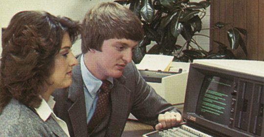 RJ Young salesman working on a computer in the 70s.